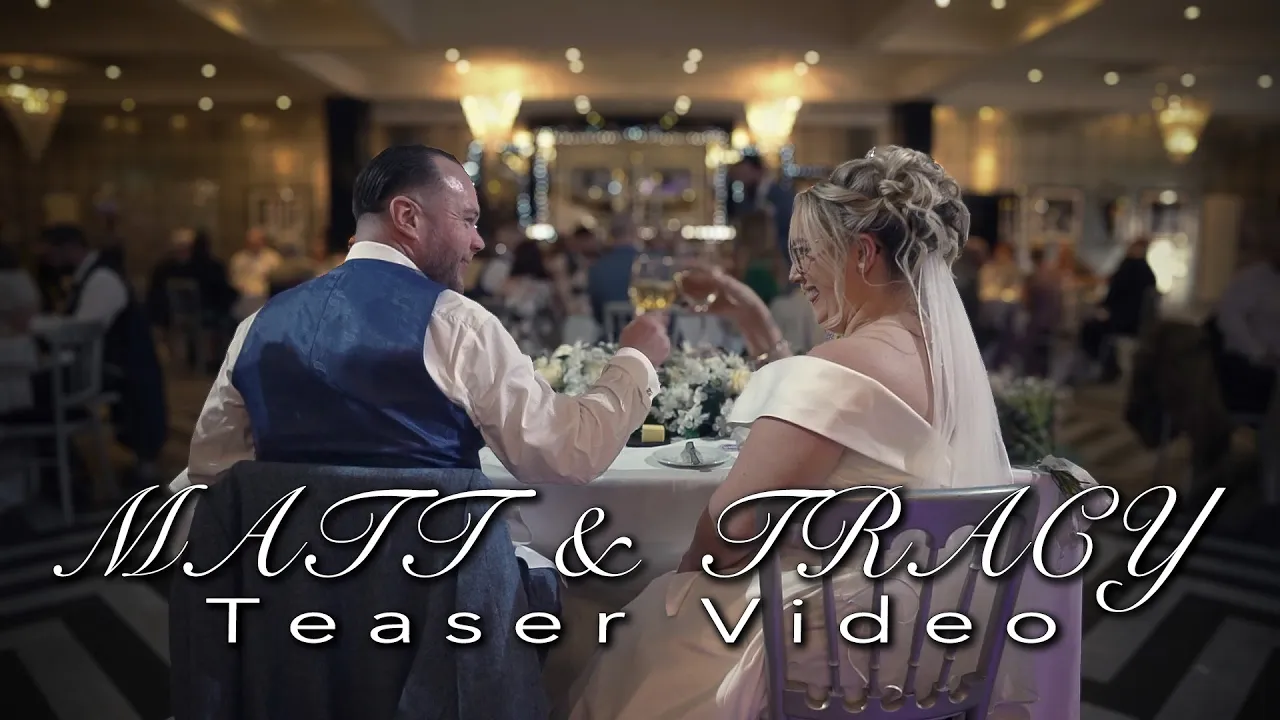 YouTube Video image of a wedding couple sat at a table